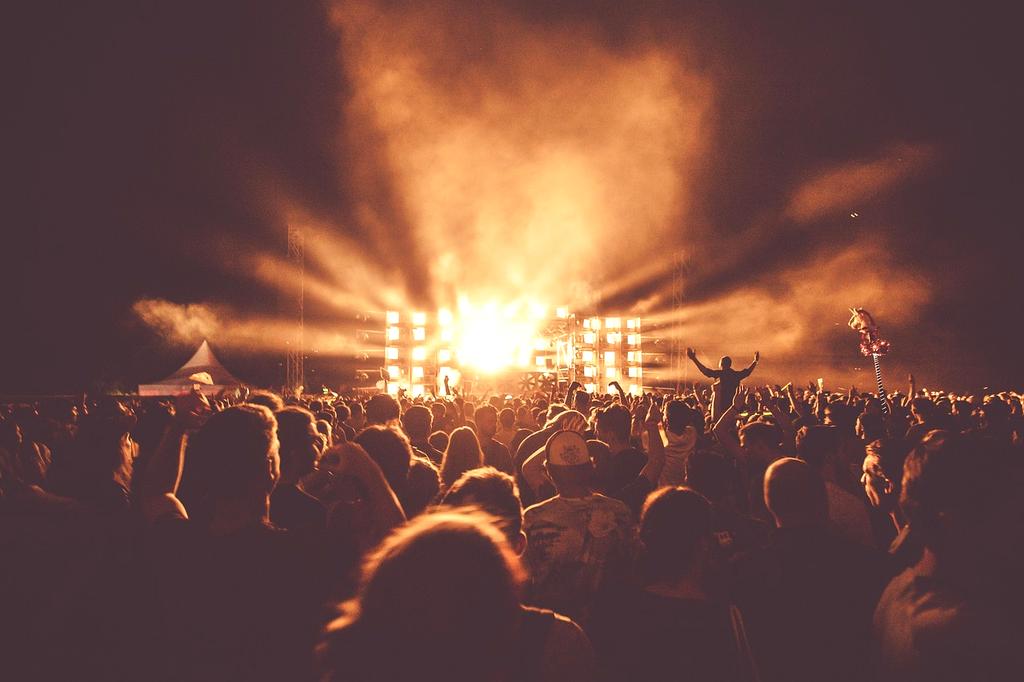 Modern entertainment stage with vibrant lighting and audience