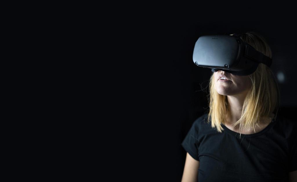 Audience wearing VR headsets at entertainment event